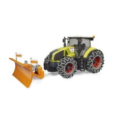 Tracteur Claas Axion 950 avec chaînes à neige et lame de charrue