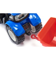 Tracteur New Holland avec fourche de palettes et palette inclue