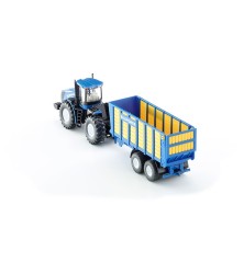 Tracteur New Holland T9.560 avec remorque d'ensilage