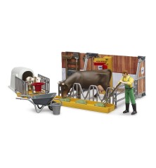 Étable, vache et veau avec agriculteur